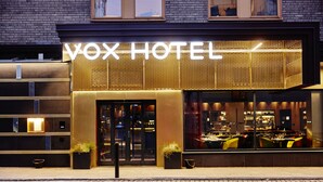 The exterior of VOX HOTEL with a modern design, large glass windows, and a prominent sign. - Vox Hotel (Jonkoping)