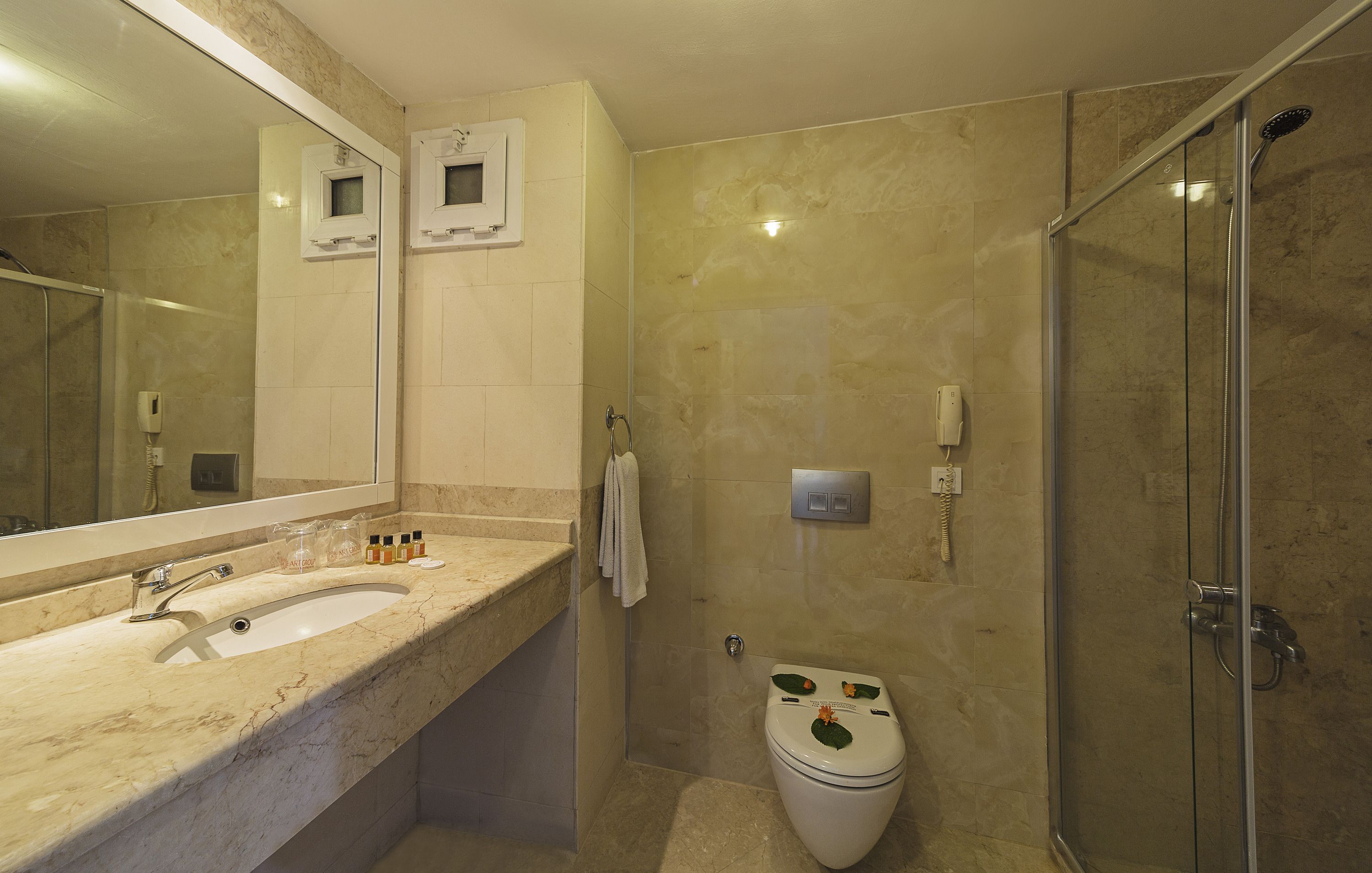 Shower, free toiletries, hair dryer, slippers