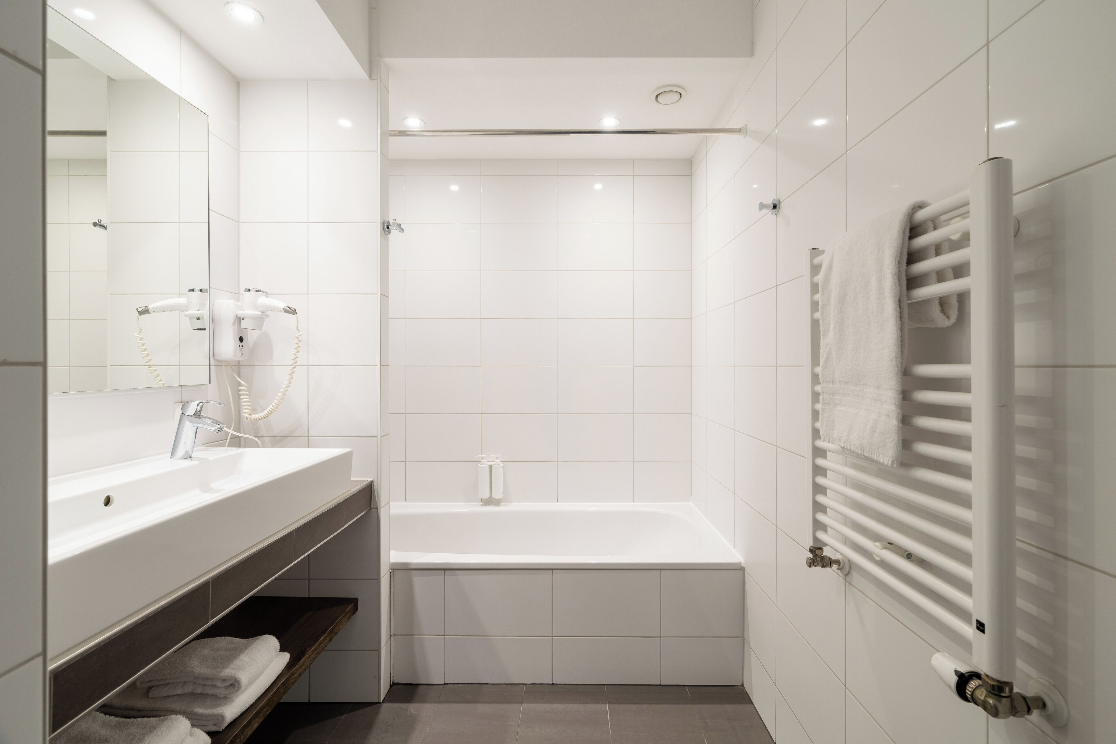 Shower, deep-soaking bathtub, free toiletries, hair dryer