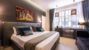 Deluxe tweepersoonskamer, 1 tweepersoonsbed of 2 eenpersoonsbedden | 1 slaapkamer, lakens van Egyptisch katoen, luxe beddengoed, donsdekens