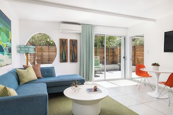 Deluxe Suite, 1 King Bed, Patio | Living area | Flat-screen TV at Del Marcos Hotel