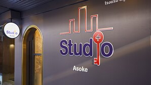 A wall with the text "Studio Asoke" and a key symbol. - Studio Asoke (Bangkok)