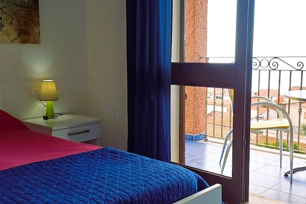 Triple Room, Balcony, Sea View | Minibar, in-room safe, desk, blackout drapes