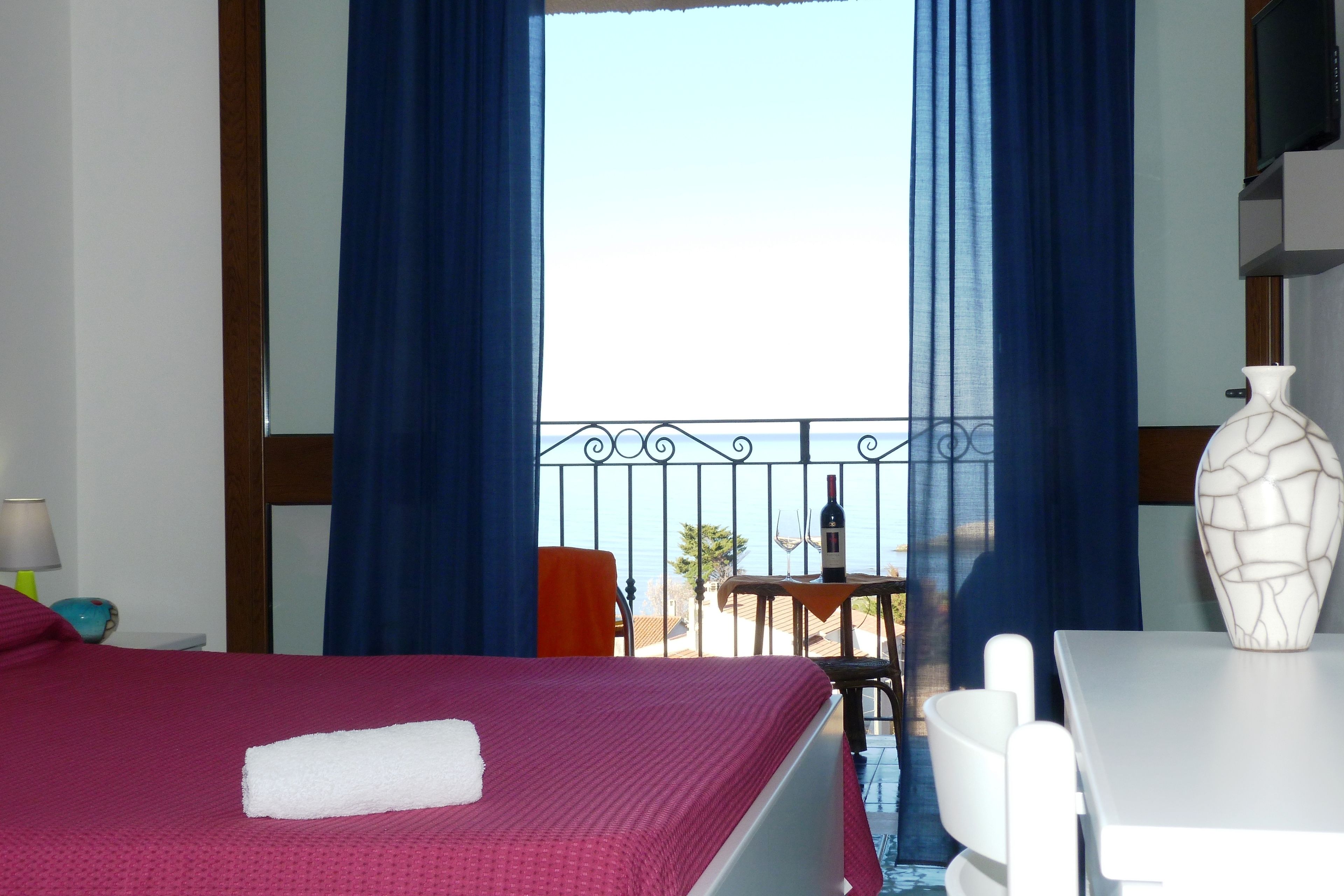 triple room, balcony, sea view | minibar, in-room safe, desk, blackout curtains