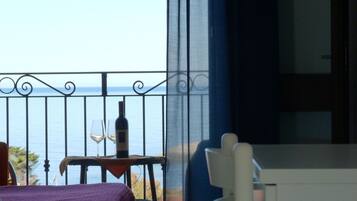 Double Room, Balcony, Sea View | Minibar, in-room safe, desk, blackout drapes