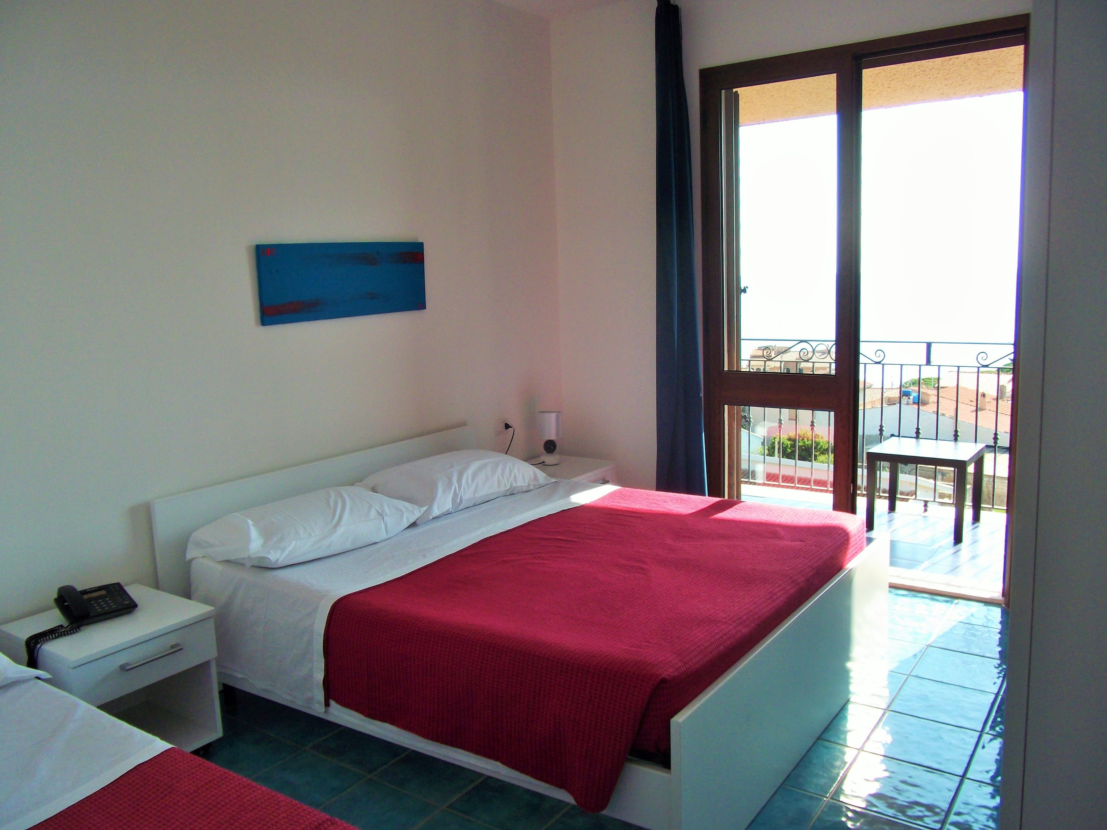 triple room, balcony, sea view | minibar, in-room safe, desk, blackout curtains