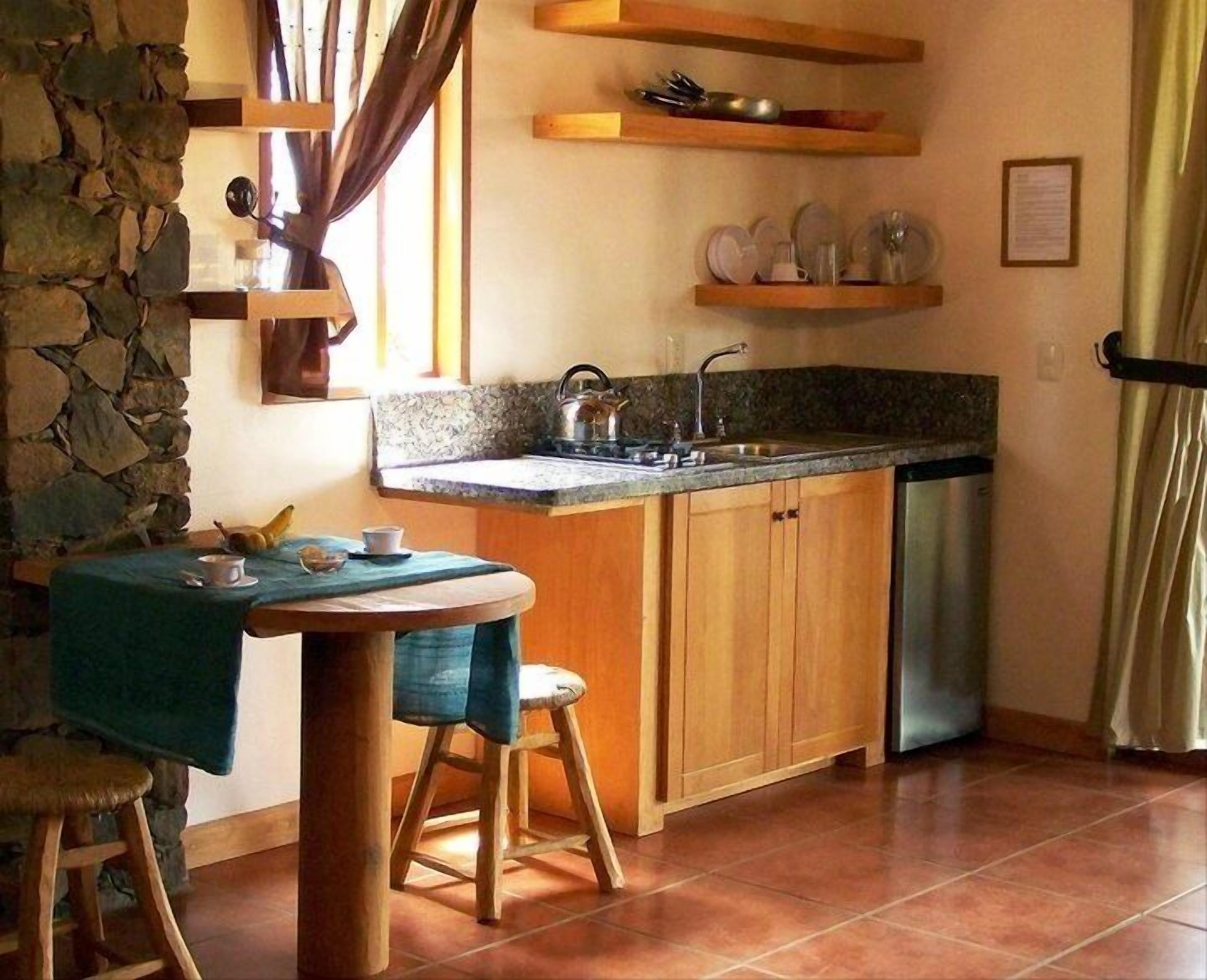 full-sized fridge, microwave, coffee/tea maker, cookware/dishes/utensils