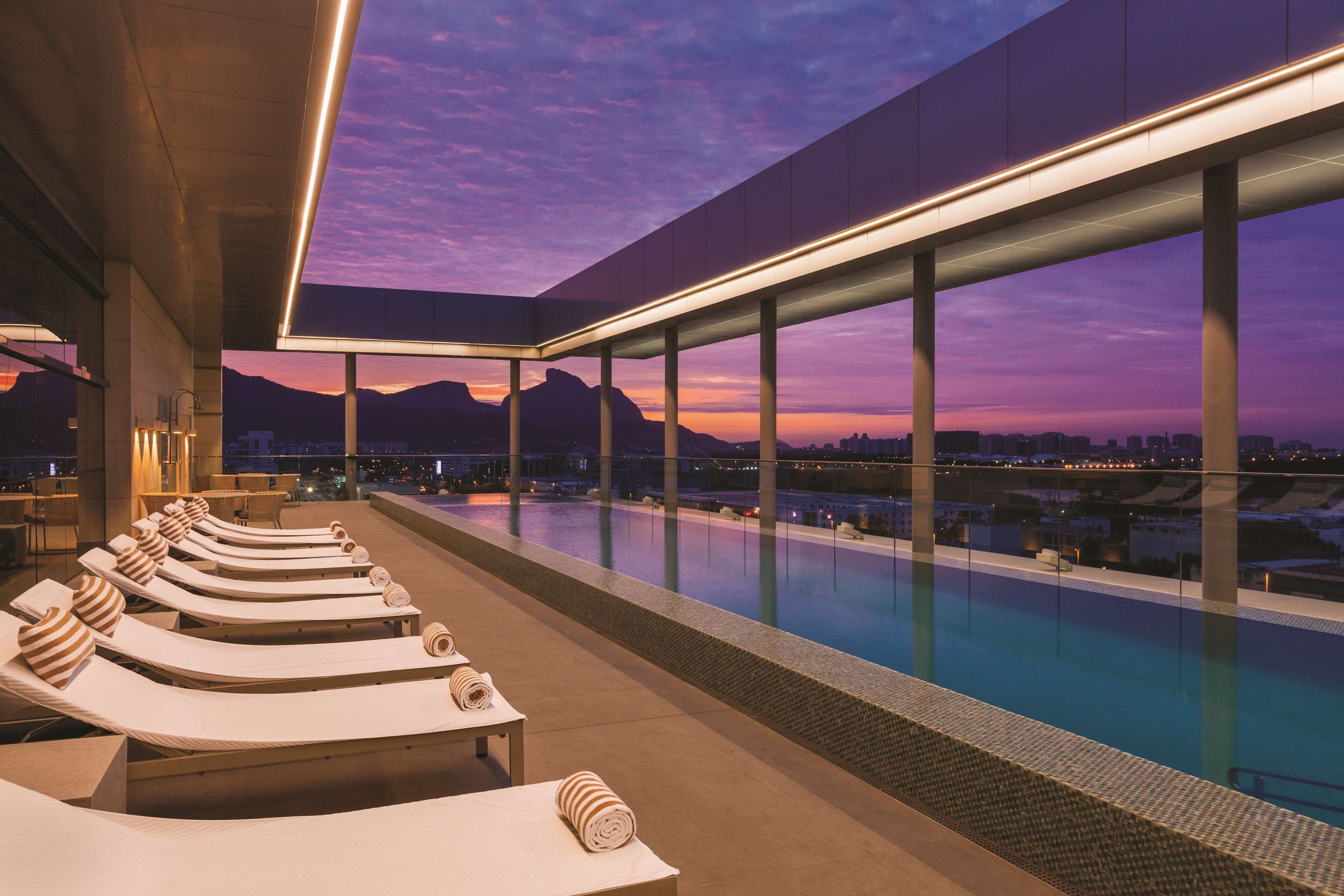 outdoor pool, open 8 am to 7:00 pm, pool loungers, lifeguards on site