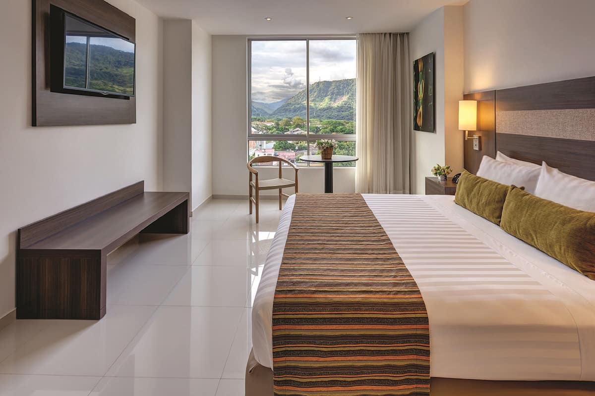 deluxe room, 1 king bed | premium bedding, in-room safe, desk, blackout curtains