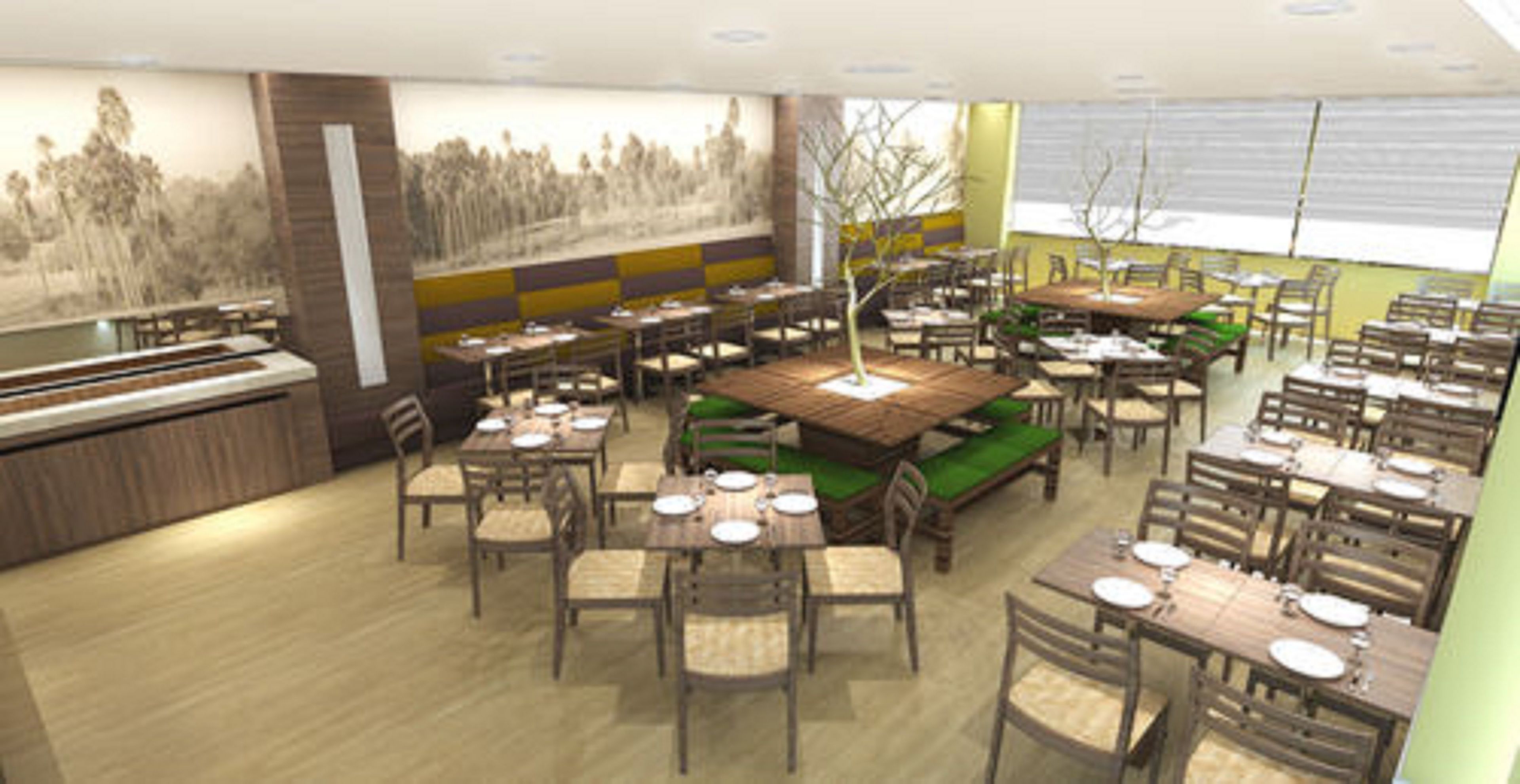 Un restaurante con varias mesas y sillas, una barra y un mural en la pared.