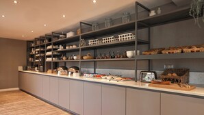 A modern kitchen with grey cabinets, wooden countertops, and a variety of kitchenware and utensils. - Van der Valk Hotel Le Catalogne Saint Aygulf (Fréjus)