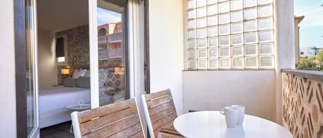 Triple Room, Balcony, Garden View | Minibar, in-room safe, desk, free WiFi