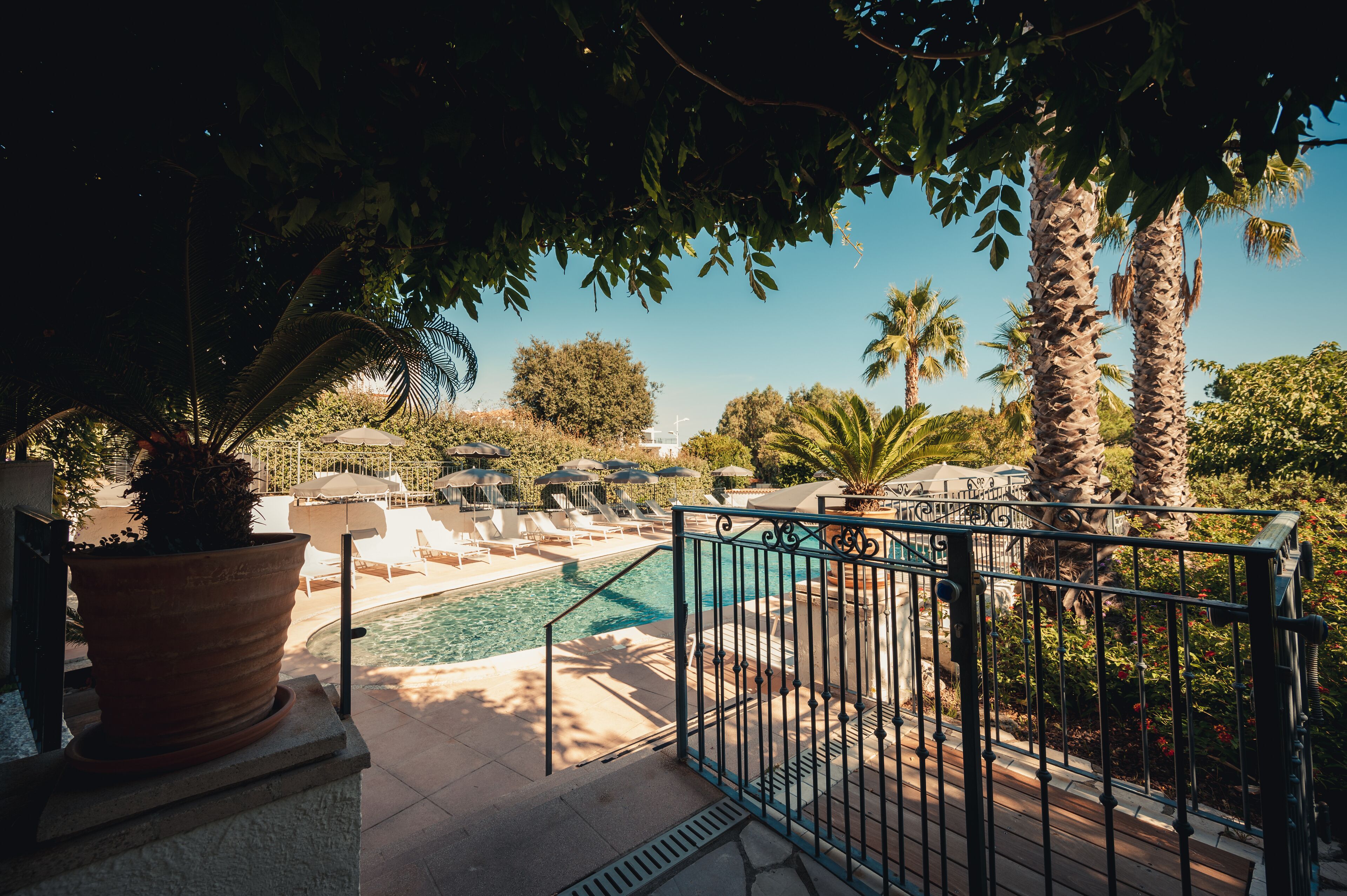 outdoor pool, pool umbrellas, pool loungers