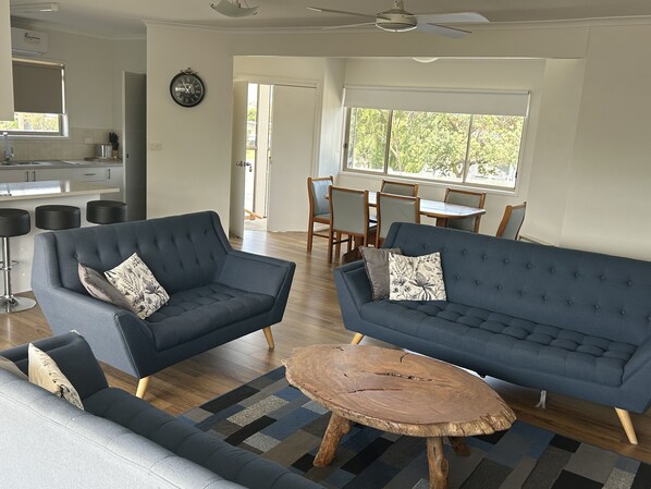 Deluxe Family Room | Iron/ironing board, bed sheets