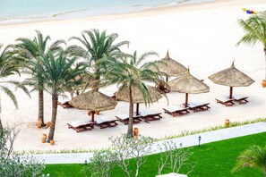 Private beach, white sand, sun loungers, beach umbrellas