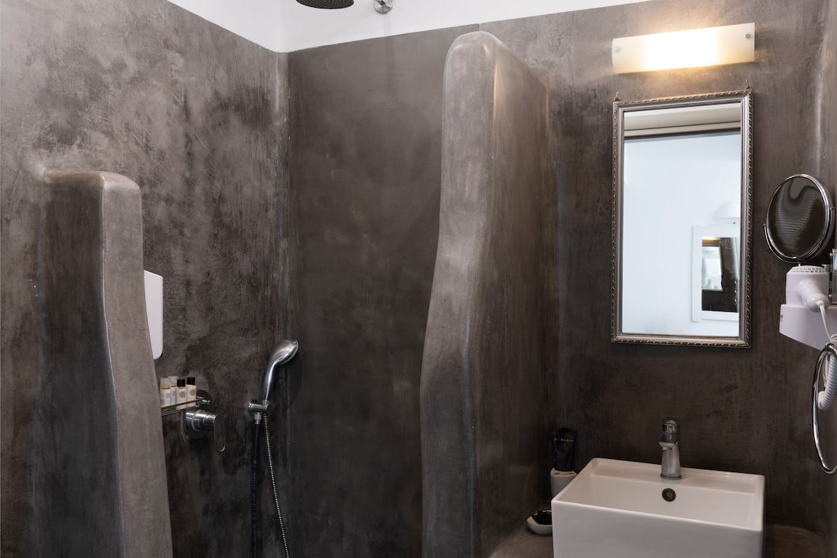 deluxe room with plunge pool | bathroom | shower, free toiletries, hair dryer, slippers