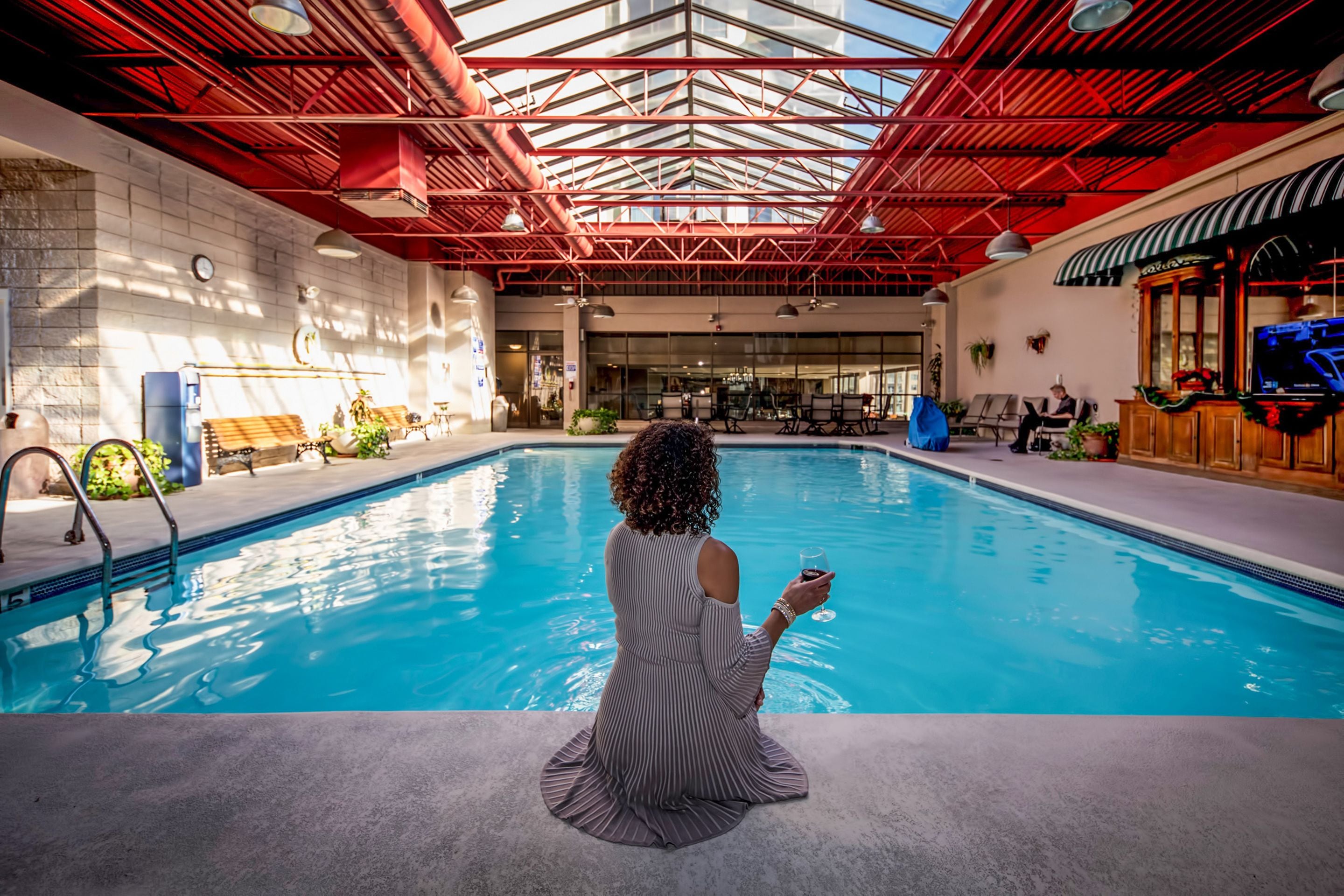 A heated pool, sun loungers