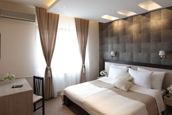 Standard Double or Twin Room | Minibar, in-room safe, desk, blackout drapes