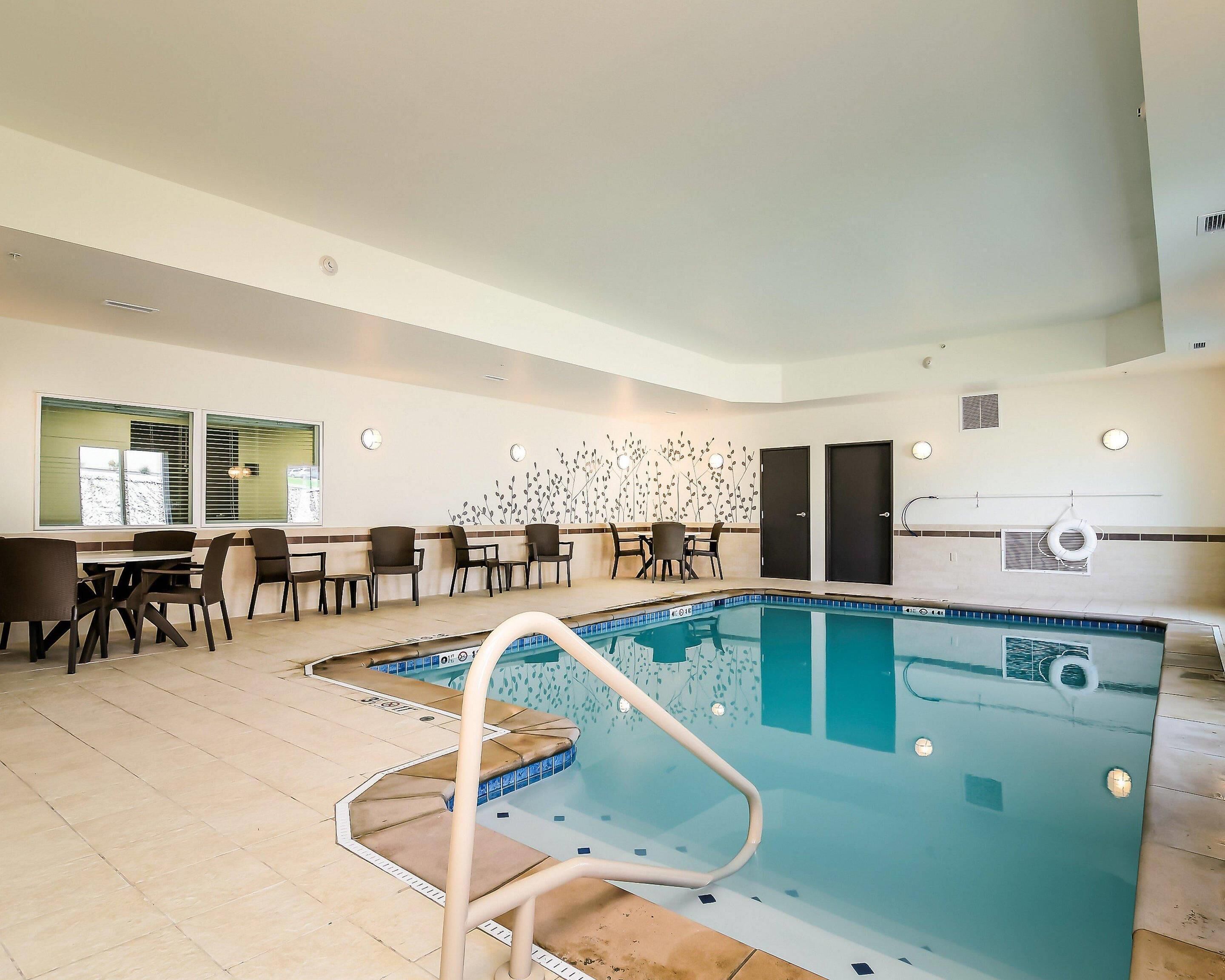 Indoor pool, open 8:00 AM to 10:00 PM, pool loungers