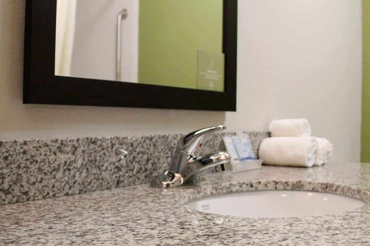 suite, 1 king bed with sofa bed, non smoking | bathroom | free toiletries, hair dryer, towels, soap