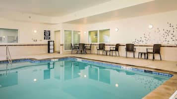 Indoor pool, open 8:00 AM to 10:00 PM, pool loungers