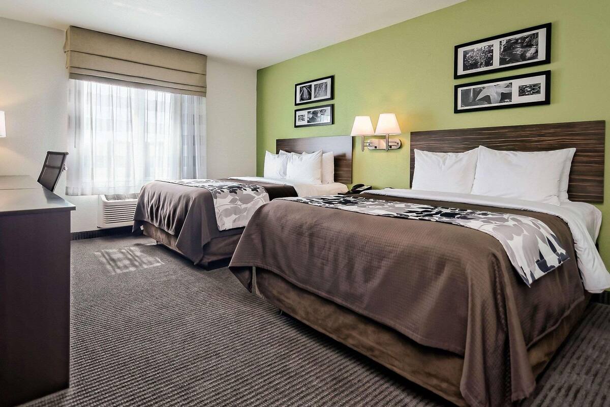 Pillowtop beds, desk, blackout drapes, iron/ironing board