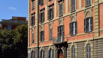 A historic building with multiple windows and a central entrance.