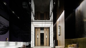A spacious lobby with a reception desk, seating area, and a large digital display. - Millennium Mitsui Garden Hotel Tokyo/Ginza (Tokyo)