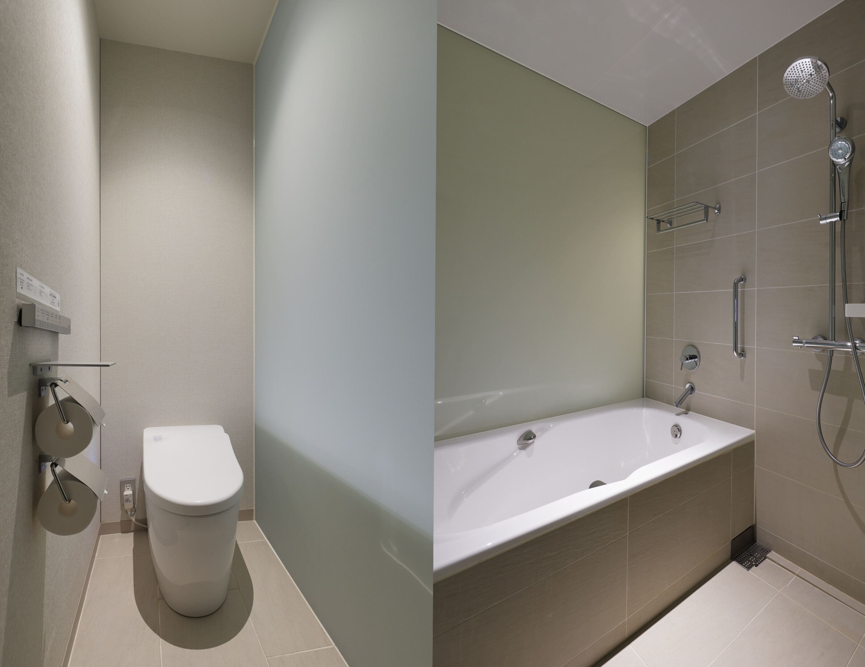 A bathroom with a toilet, a bathtub, and a shower.