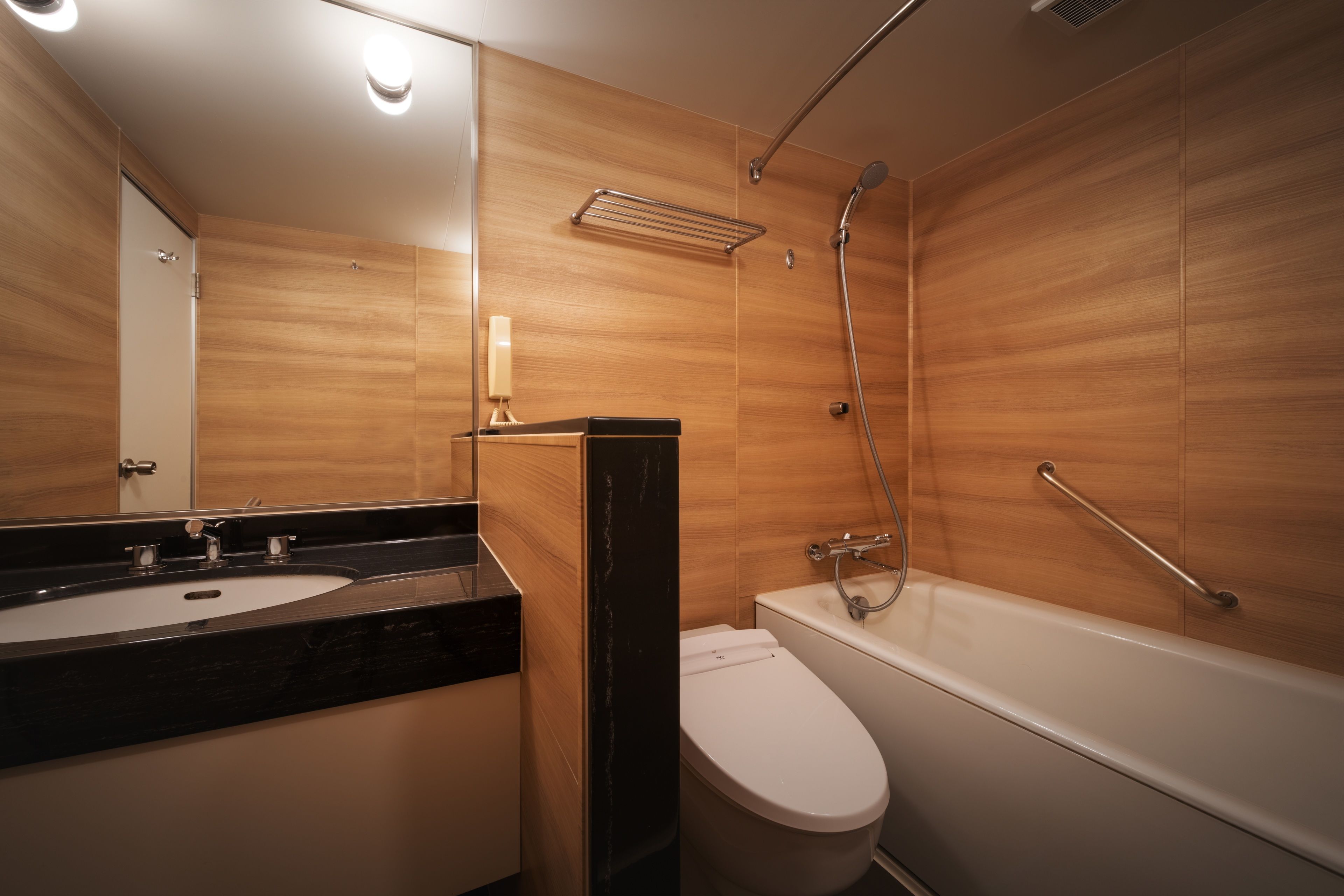 combined shower/bathtub, free toiletries, hair dryer, slippers