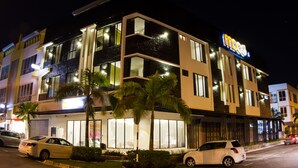 A multi-story hotel with a modern design, featuring large windows and a prominent sign. - Mood Hotel (Johor Bahru)