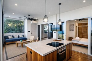 Pacific Suite Apartment | Private kitchen | Stovetop, blender, coffee grinder, freezer