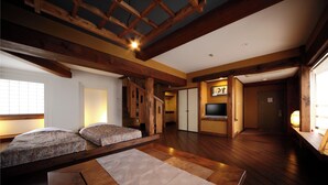 A traditional Japanese-style room with tatami flooring, a low wooden ceiling, and a sliding door leading to another room. - Hotel Asyl Nara (Nara)