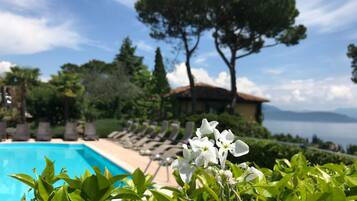 Outdoor pool, a rooftop pool, open 8:00 AM to 9:00 PM, pool umbrellas