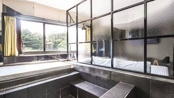 Suite Double Room | Bathroom | Separate tub and shower, rainfall showerhead, free toiletries