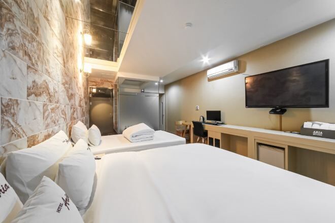 Premium bedding, pillow-top beds, free minibar, desk