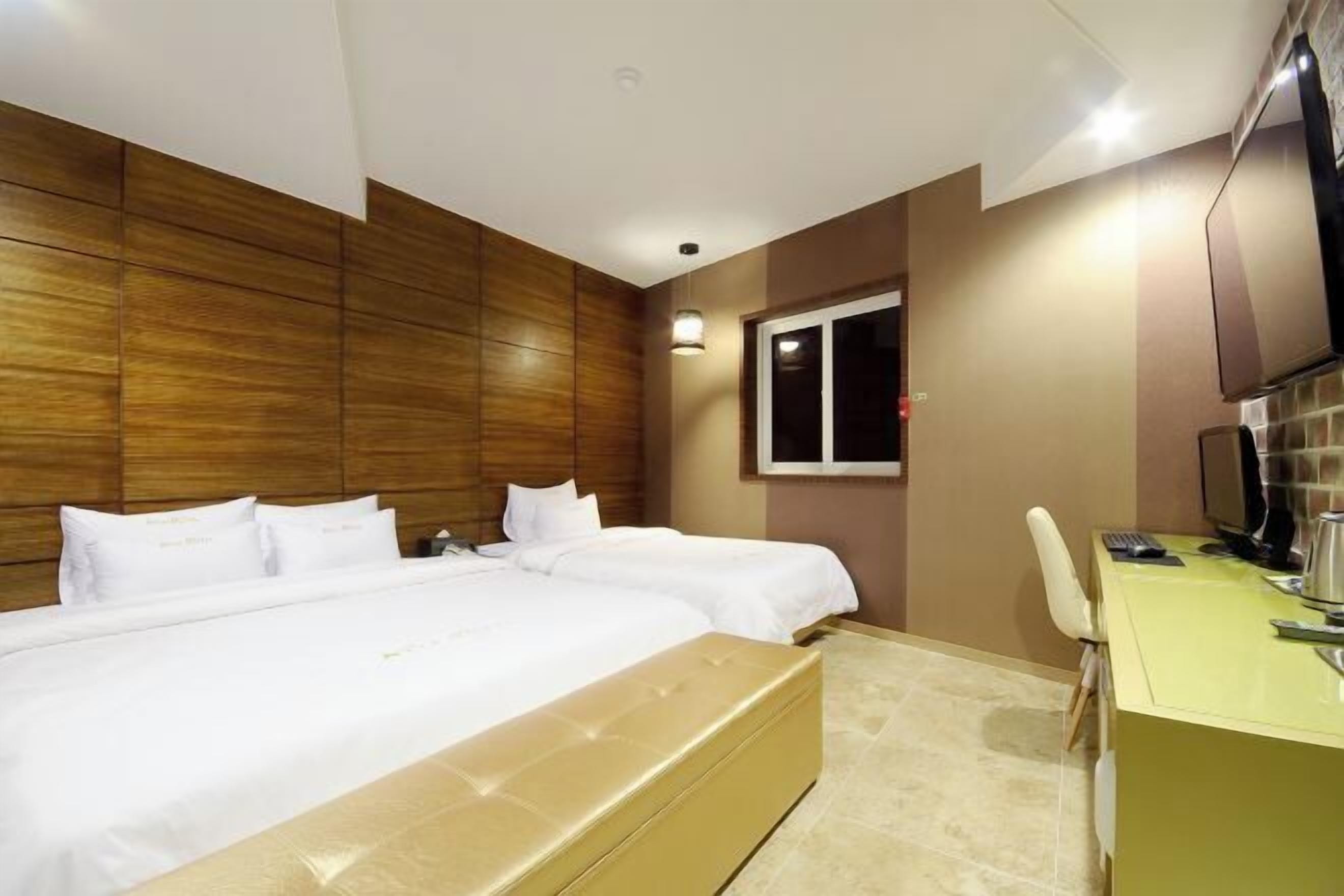 Premium bedding, pillow-top beds, free minibar, desk