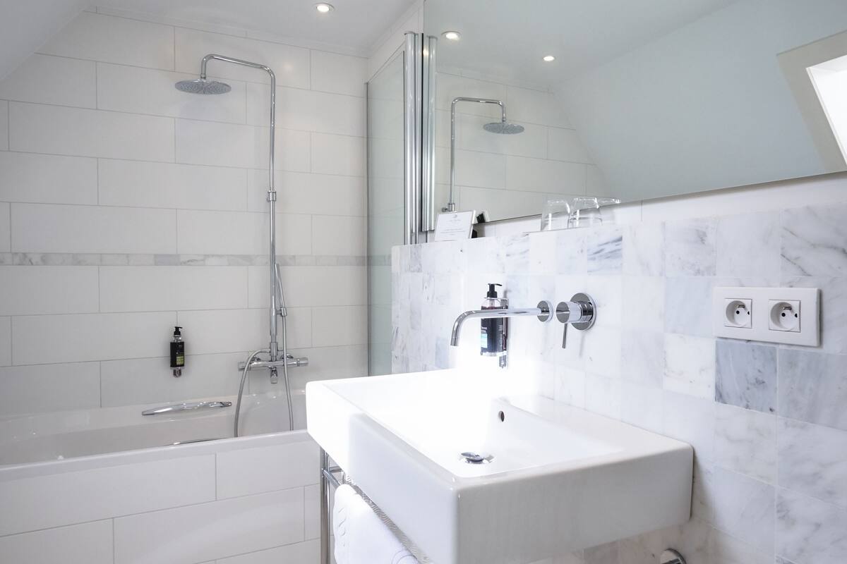 loft | bathroom | hair dryer, slippers, towels