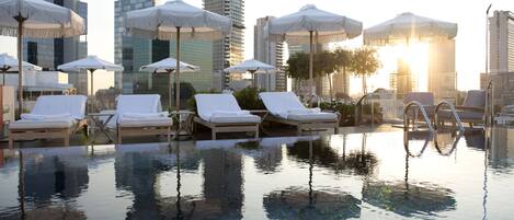 Seasonal outdoor pool, pool umbrellas, sun loungers