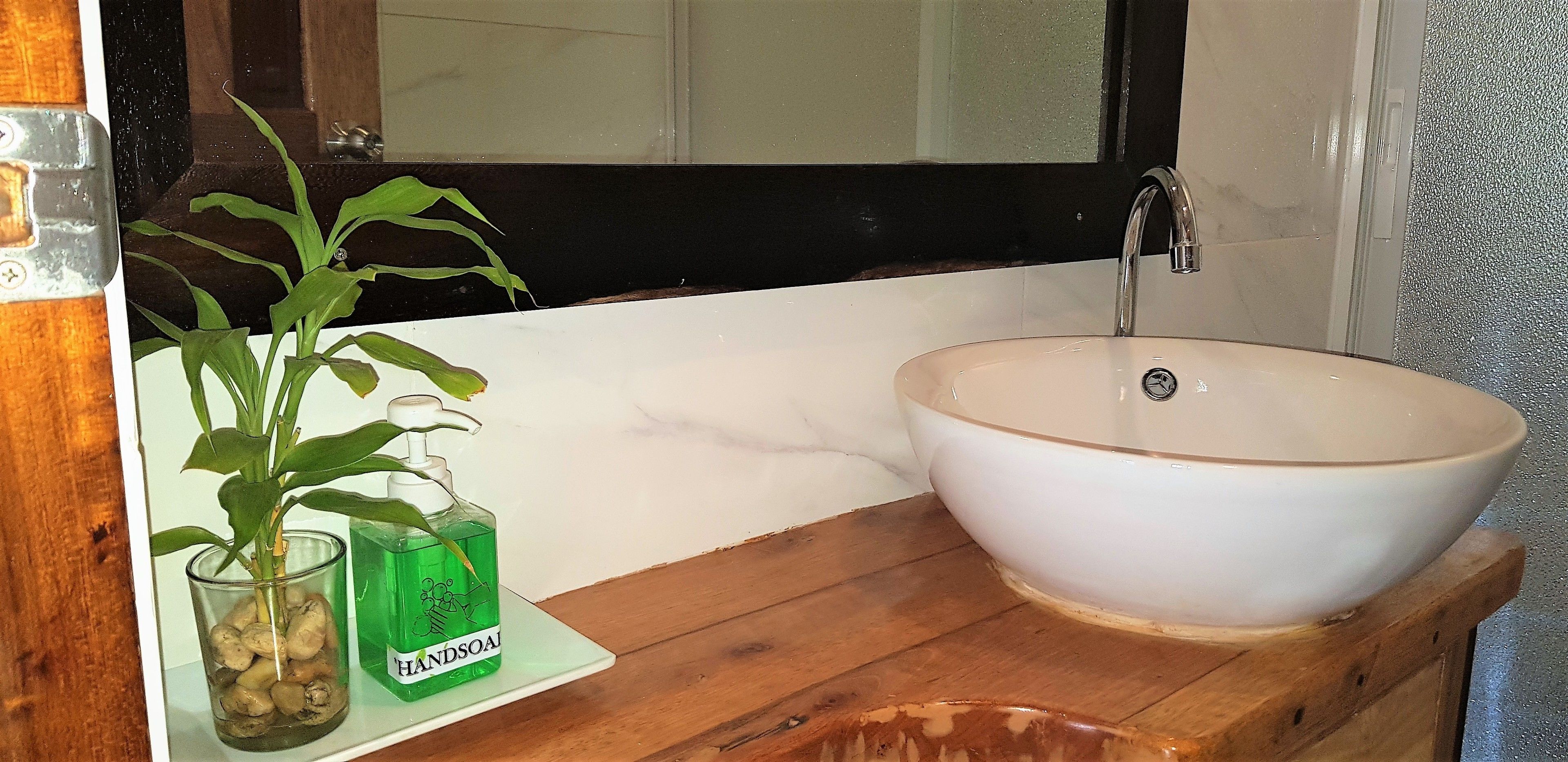 deluxe seaview | bathroom | shower, hair dryer, towels