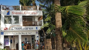 A two-story building with a balcony, named "Sunset Rooft Bar" and "DiveGurus". - DiveGurus Boracay Beach Resort (Boracay Island)