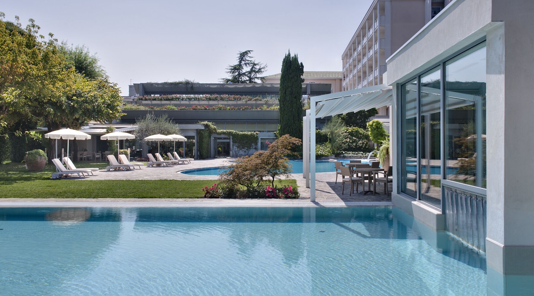 indoor pool, 2 outdoor pools, pool umbrellas, pool loungers