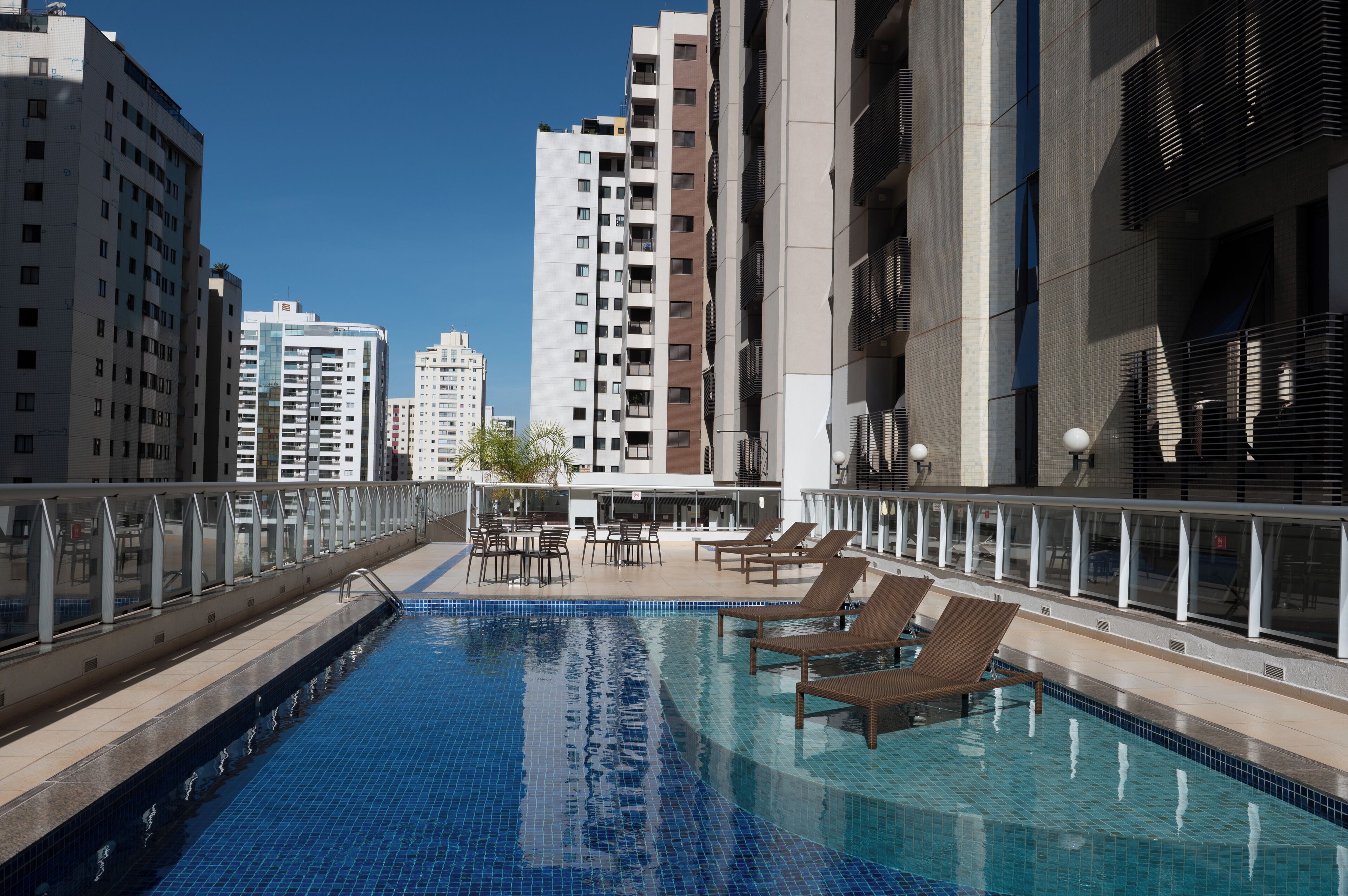 outdoor pool, open 8:00 am to 8:00 pm, pool umbrellas, pool loungers