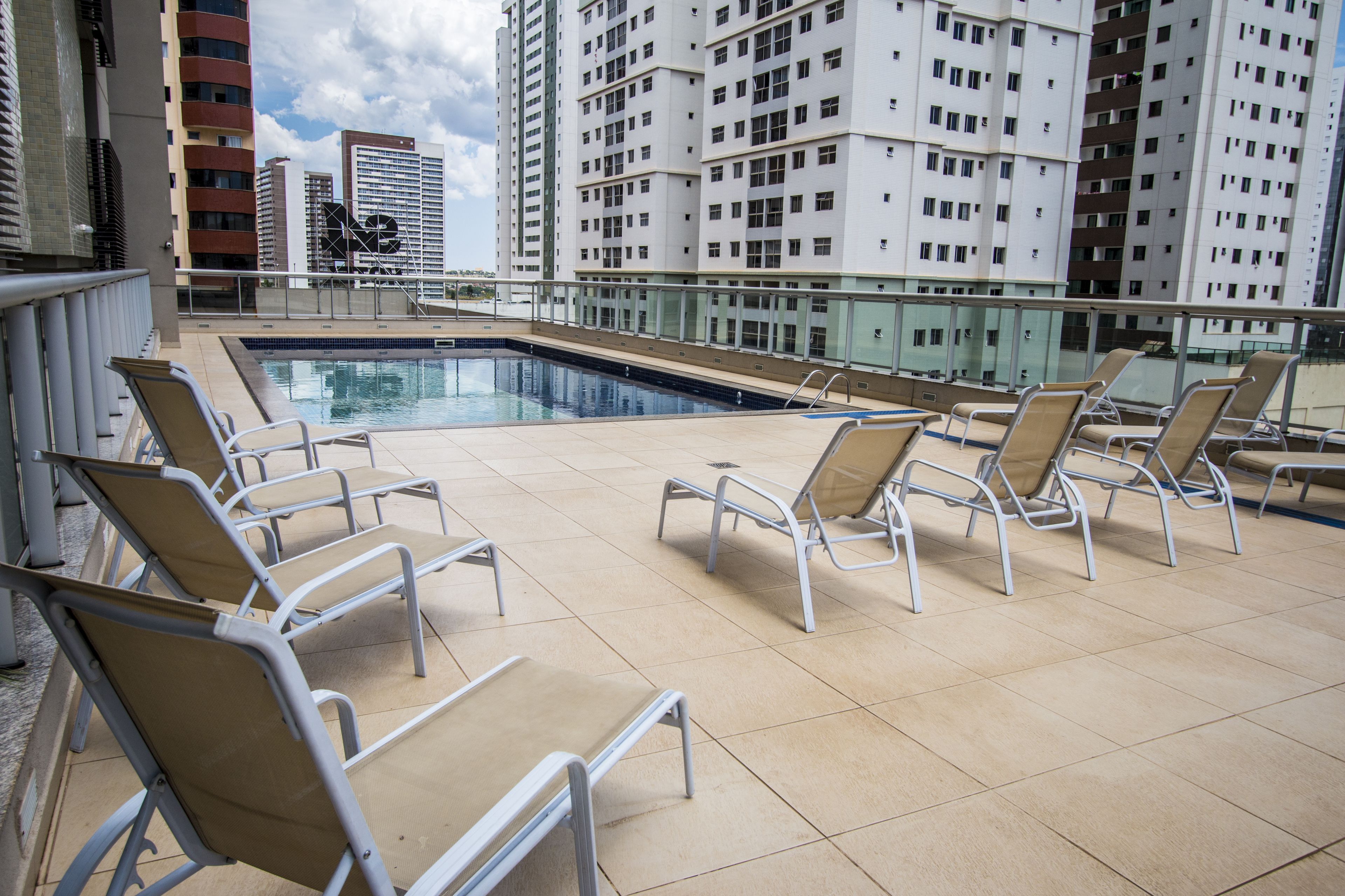 outdoor pool, open 8:00 am to 8:00 pm, pool umbrellas, pool loungers