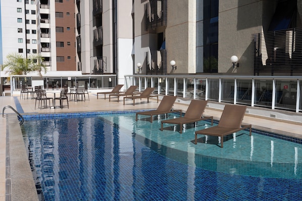 Outdoor pool, open 8:00 AM to 8:00 PM, pool umbrellas, pool loungers