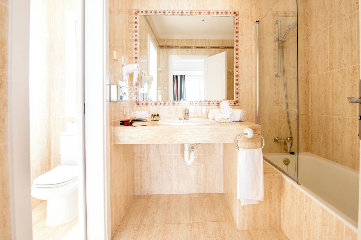 shower, designer toiletries, hair dryer, bidet