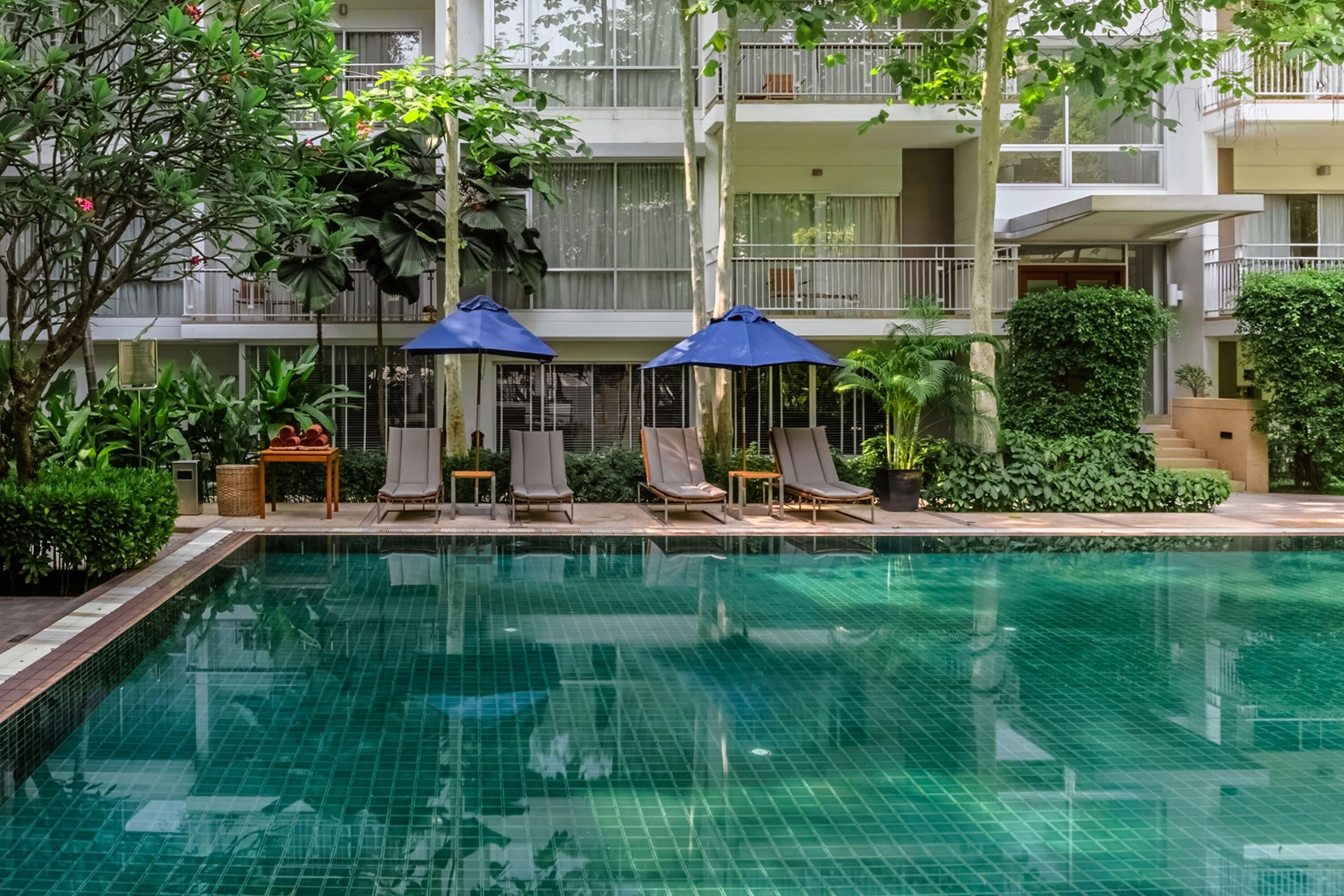 outdoor pool, open 7:00 am to 7:00 pm, pool umbrellas, pool loungers