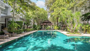 Outdoor pool, open 7:00 AM to 7:00 PM, pool umbrellas, pool loungers