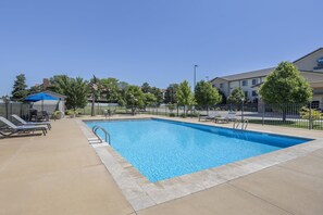 Seasonal outdoor pool, open 6:00 AM to 10:30 PM, pool loungers