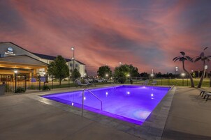 Seasonal outdoor pool, open 6:00 AM to 10:30 PM, pool loungers